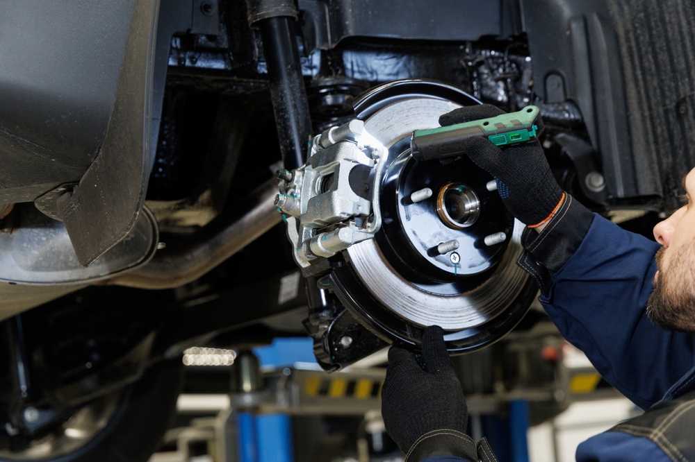 A,Mechanic,In,A,Car,Service,Diagnoses,The,Brake,System